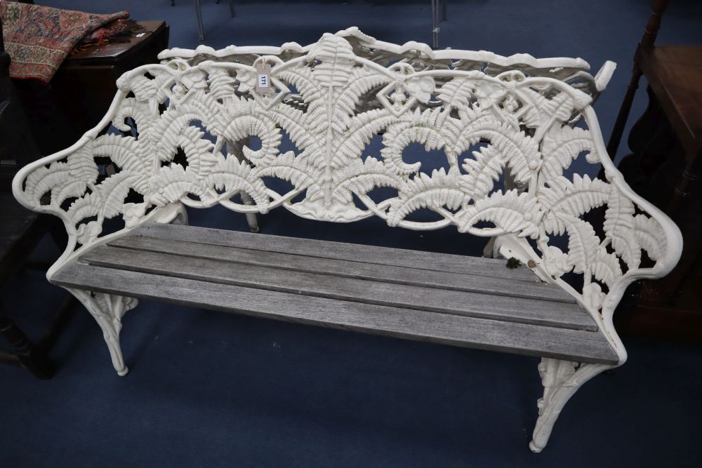 A pair of Coalbrookdale style cast iron garden benches, in fern pattern, with teak slats, width 151cm, depth 26cm